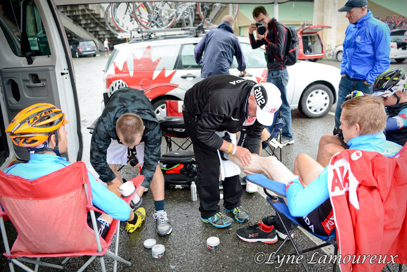 Canadian National Team rders put on embrocation for the cold rai