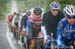 Field is single-filed in the rain early in the stage